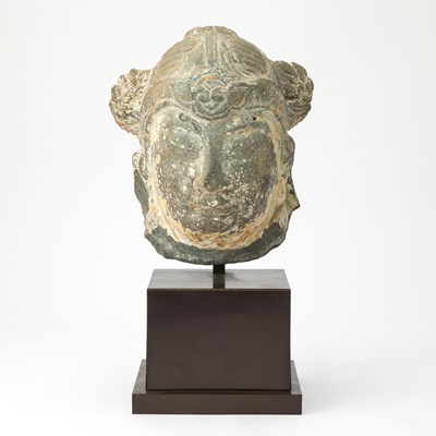 Lot 146 - A Chinese Stone Head of a Guardian