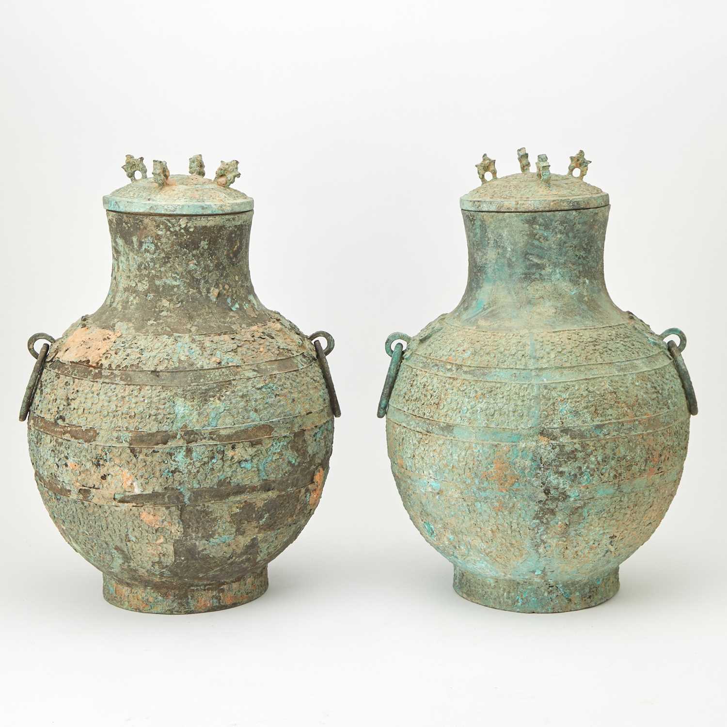 Lot 90 - A Pair of Chinese Bronze Lidded Wine Vessels