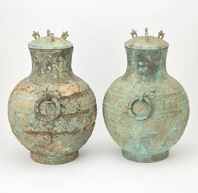 Lot 90 - A Pair of Chinese Bronze Lidded Wine Vessels