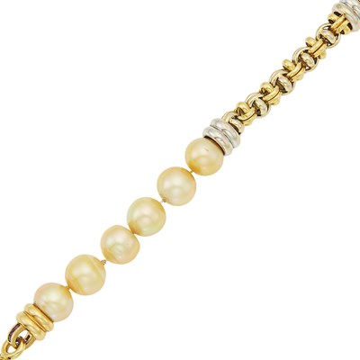 Lot 1044 - Two-Color Gold, Semi-Baroque Golden Cultured Pearl, Cabochon Sapphire and Ruby Bracelet