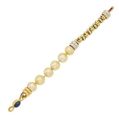 Lot 1044 - Two-Color Gold, Semi-Baroque Golden Cultured Pearl, Cabochon Sapphire and Ruby Bracelet