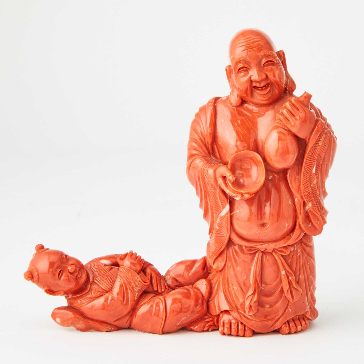 Lot 10 - A Chinese Coral Carving of Budai and an Attendant