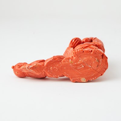 Lot 10 - A Chinese Coral Carving of Budai and an Attendant