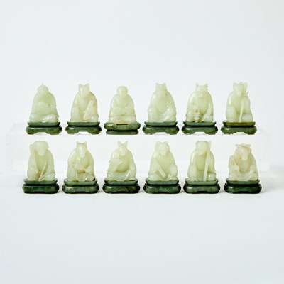 Lot 62 - A Group of Twelve Chinese White Jade Zodiac Figures and Stands