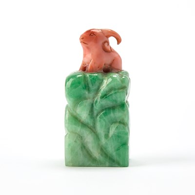 Lot 309 - A Chinese Jadeite Snuff Bottle with a Coral Stopper
