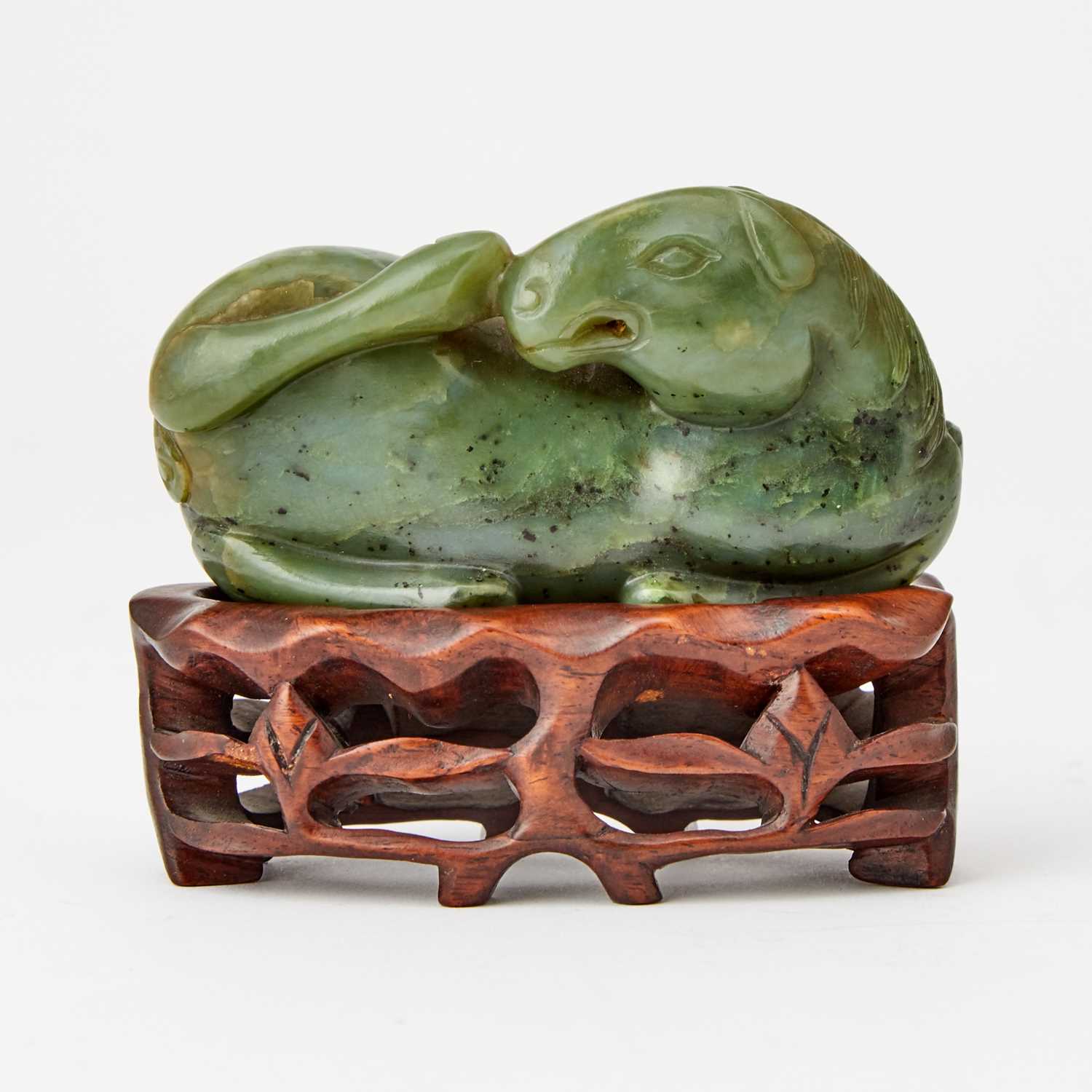 Lot 76 - A Chinese Spinach Jade Carving of a Recumbent Horse