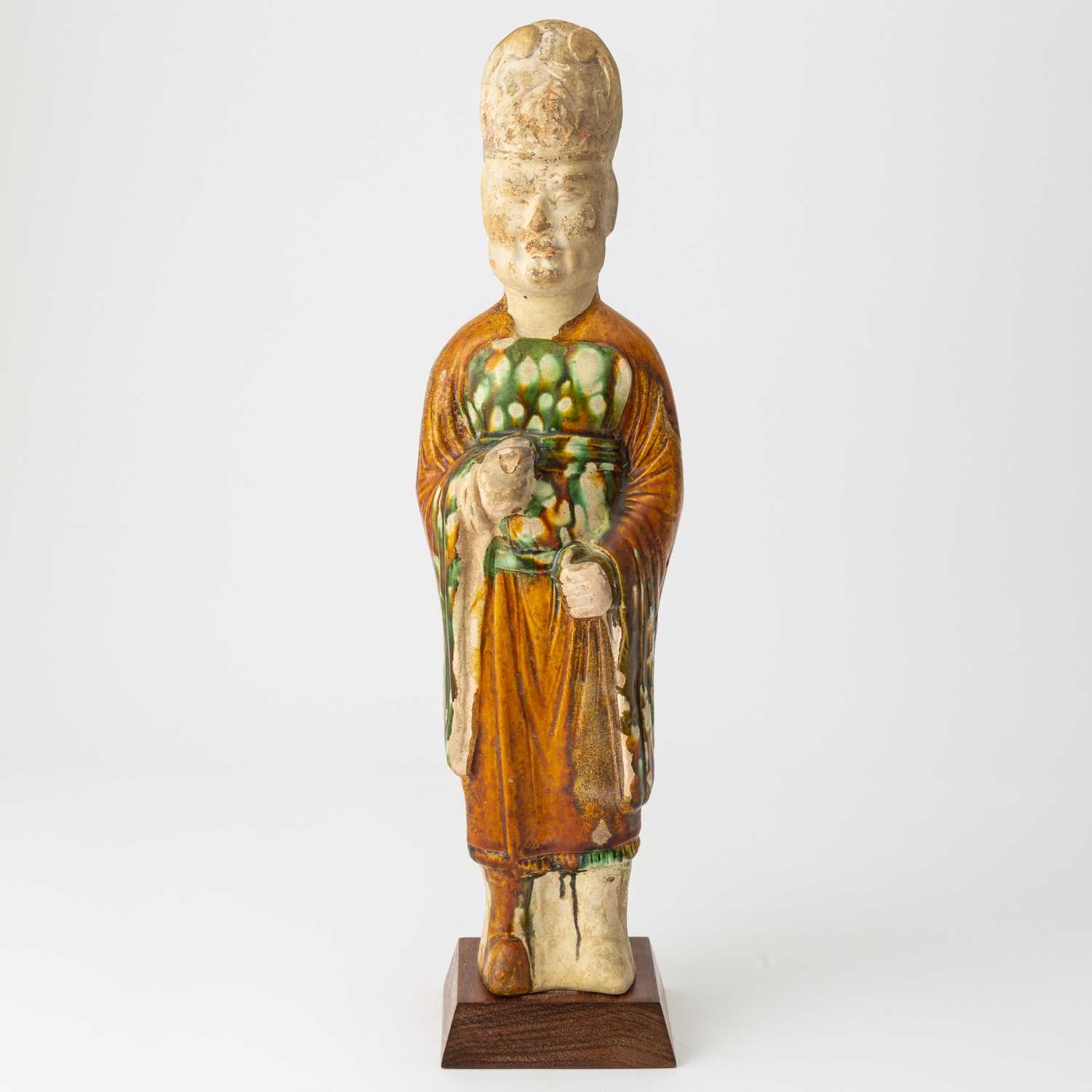 Lot 166 - A Chinese Sancai Glazed Pottery Figure of an Attendant
