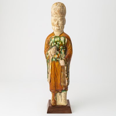 Lot 166 - A Chinese Sancai Glazed Pottery Figure of an Attendant