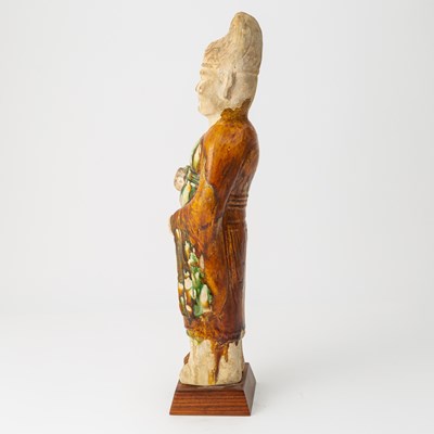 Lot 166 - A Chinese Sancai Glazed Pottery Figure of an Attendant