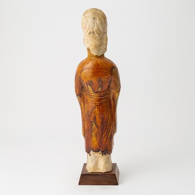 Lot 166 - A Chinese Sancai Glazed Pottery Figure of an Attendant