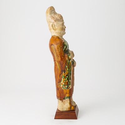 Lot 166 - A Chinese Sancai Glazed Pottery Figure of an Attendant