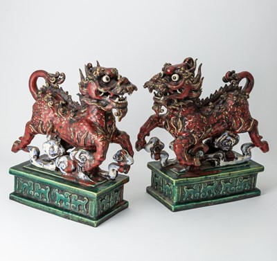 Lot 670 - A Pair of Chinese Tilework Figures of Qilin