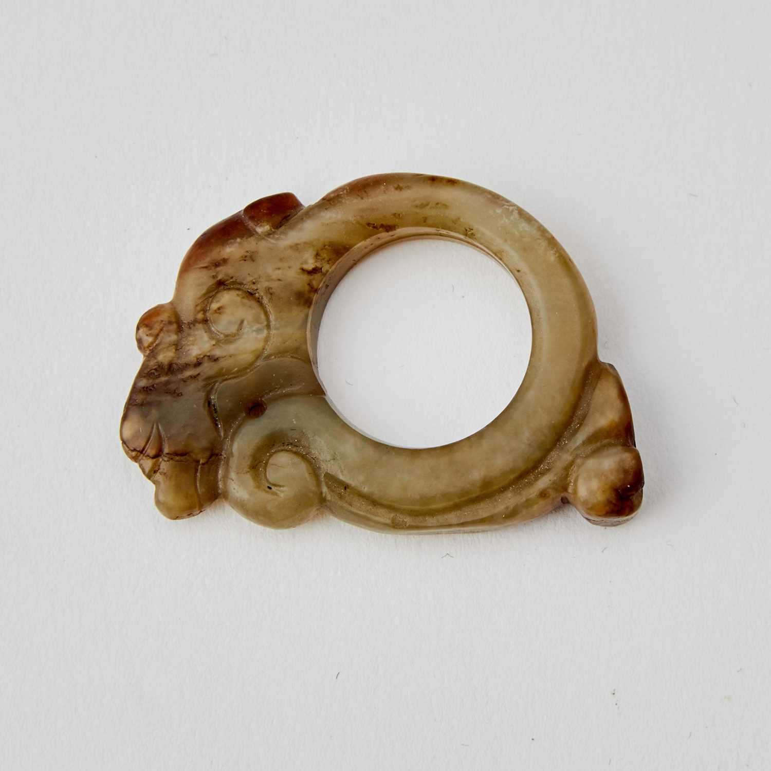 Lot 25 - A Chinese Archaistic Celadon Jade Ring