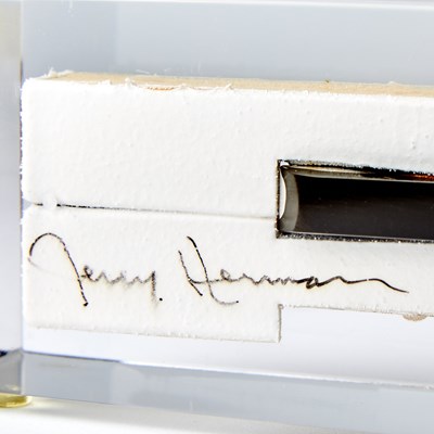 Lot 212 - Lucite Cased Ebony Piano Key signed by Jerry Herman