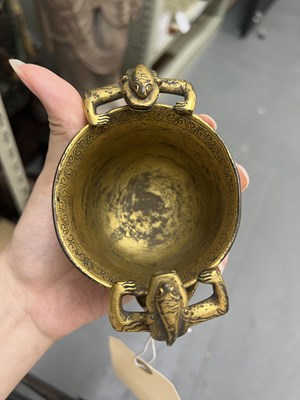 Lot 97 - A Chinese Gilt Bronze Twin-Handled ‘Chilong’ Cup