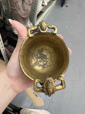 Lot 97 - A Chinese Gilt Bronze Twin-Handled ‘Chilong’ Cup