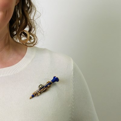 Lot 98 - Chaumet Paris Gold, Lapis and Diamond Clarinet Brooch