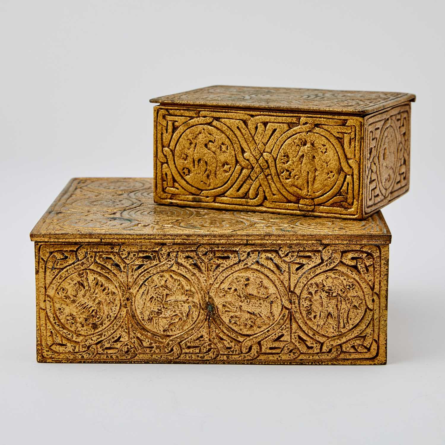 Lot 375 - Two Tiffany Studios Gilt-Bronze Zodiac Pattern Desk Boxes