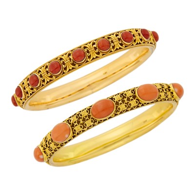 Lot 1021 - Two Antique Gold and Coral Bangle Bracelets