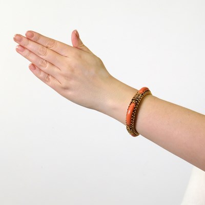 Lot 8 - Gold and Coral Bangle Bracelet