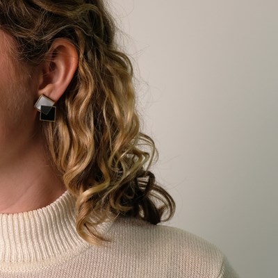 Lot 163 - Angela Cummings Pair of Gold, Black Jade, Hematite, Mother-of-Pearl and Coral Stacked Square Earclips