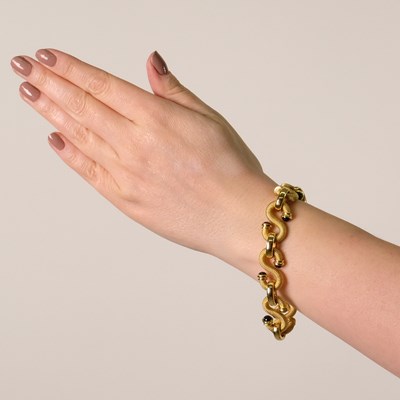 Lot 143 - Gold and Cabochon Sapphire 'S' Link Bracelet