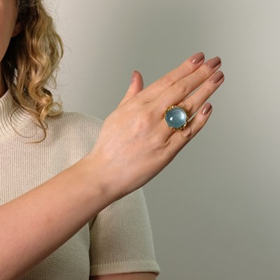 Lot 94 - Seaman Schepps Gold and Cabochon Blue Topaz Ring