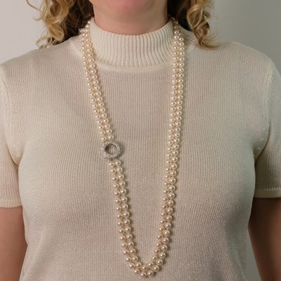 Lot 50 - Long Double Strand Cultured Pearl, White Gold and Diamond Necklace