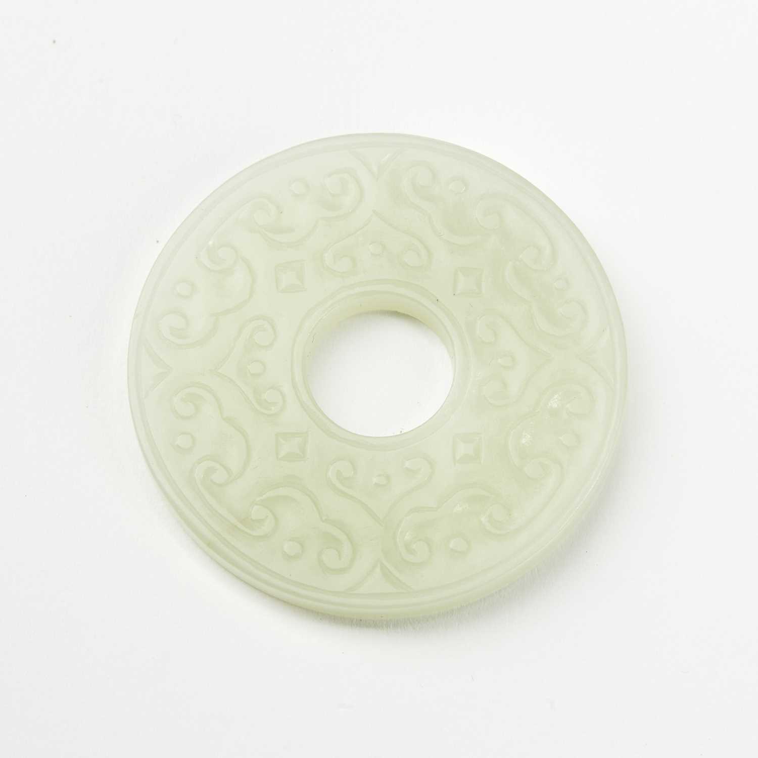 Lot 53 - A Chinese White Nephrite Jade Bi