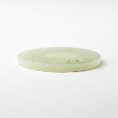 Lot 53 - A Chinese White Nephrite Jade Bi