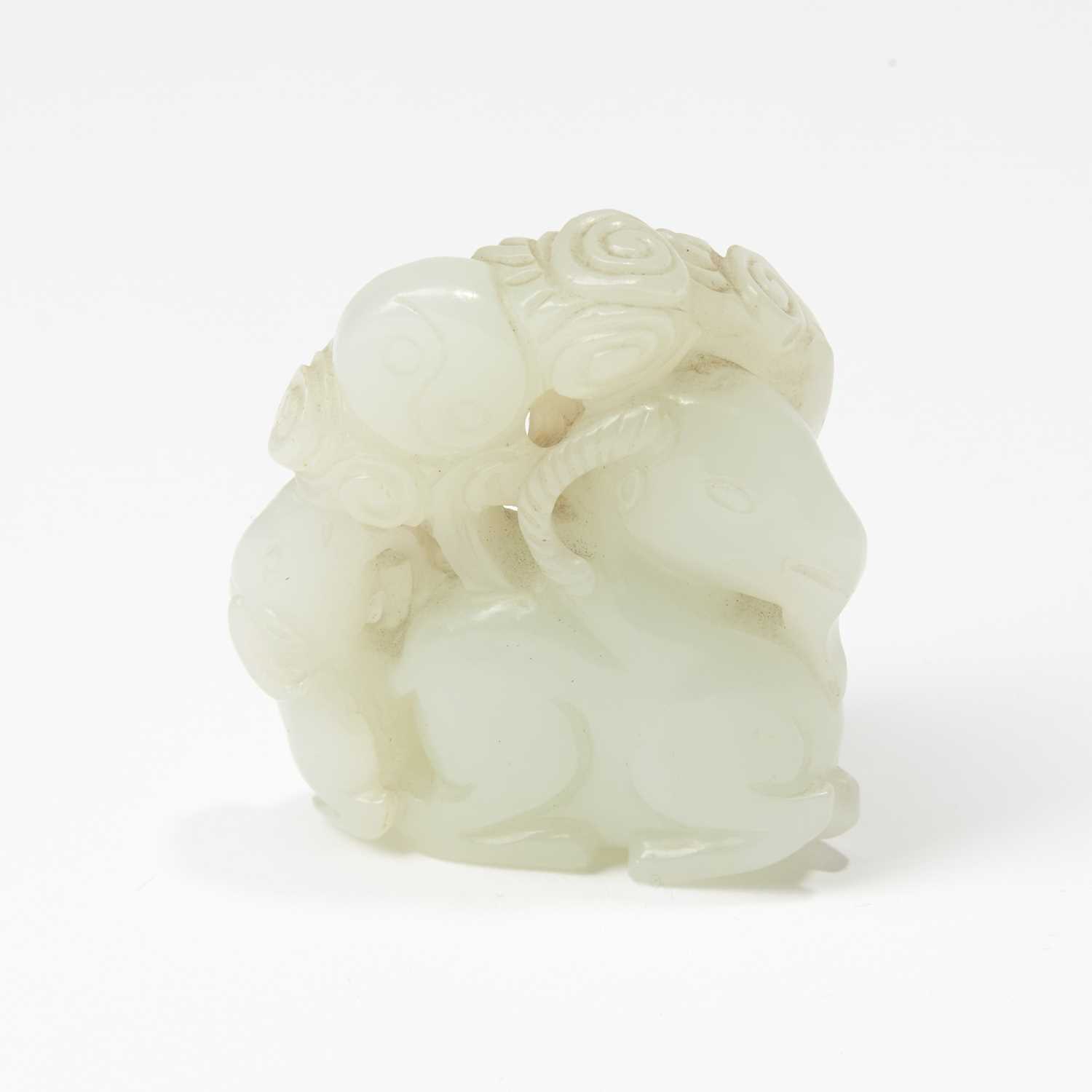 Lot 63 - A Chinese White Jade Carving of Three Rams