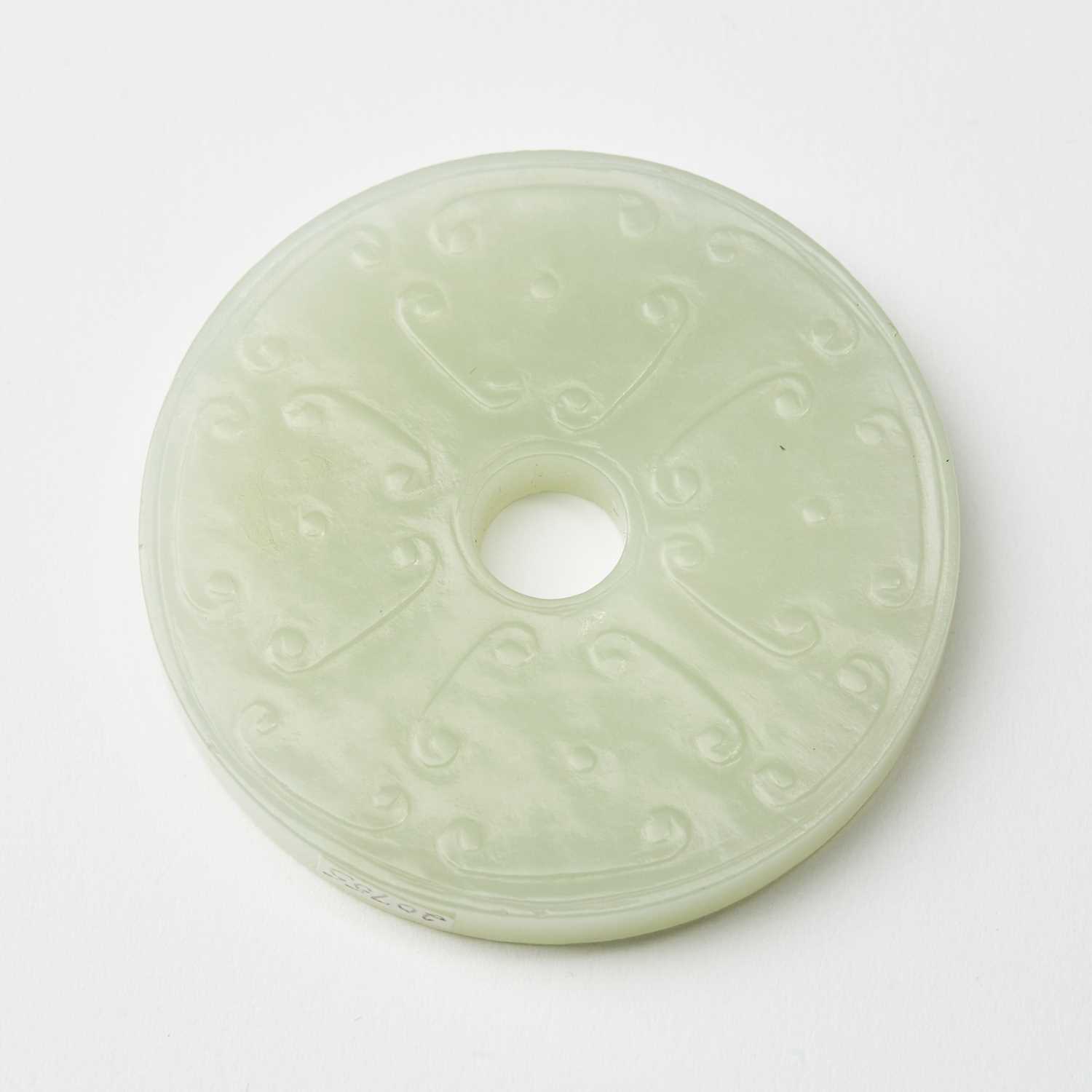 Lot 60 - A Chinese White Jade Bi