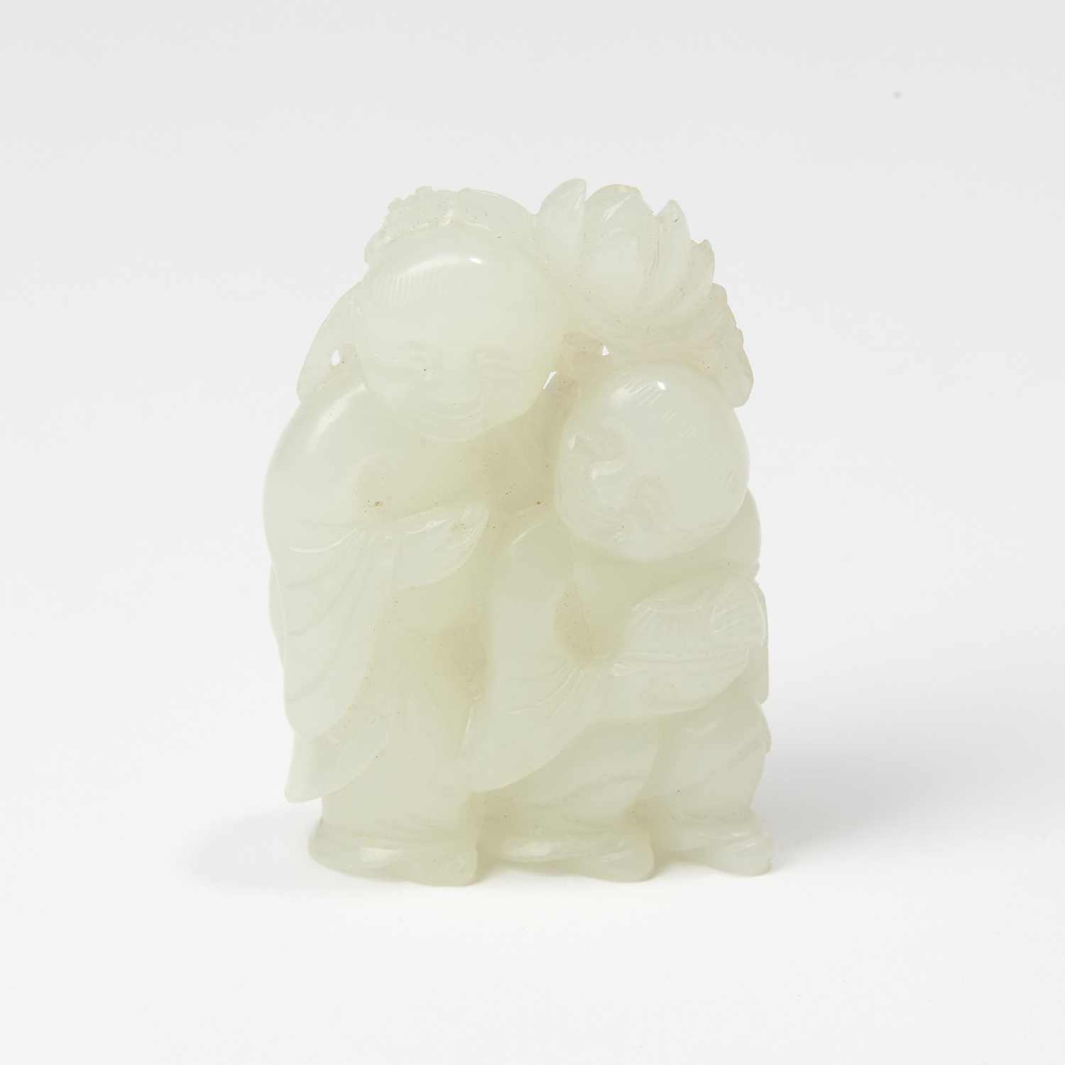 Lot 38 - A Chinese Translucent White Jade Carving of Hehe Erxian