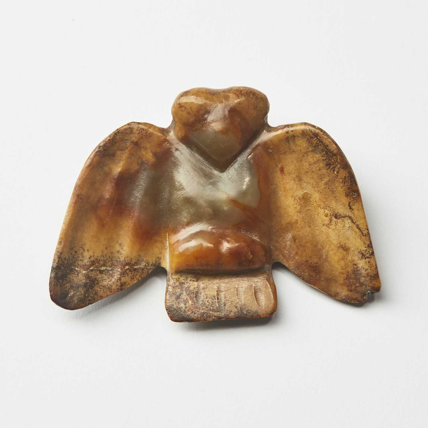 Lot 22 - A Chinese Archaistic Hongshan-Type Jade Owl Pendant