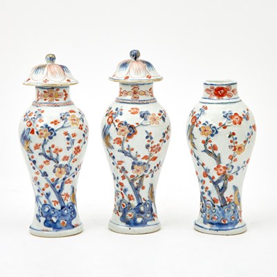 Lot 138 - A Pair of Imari Molded Porcelain Covered Vases