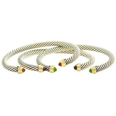 Lot 2266 - David Yurman Three Silver, Gold and Gem-Set Bangles