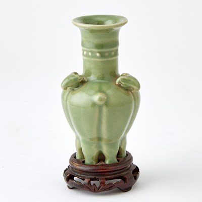 Lot 685 - A Chinese Longquan Celadon Three Goats Vase