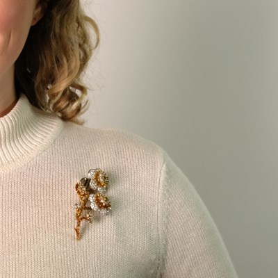 Lot 59 - Gold, Platinum, Emerald and Diamond Flower Clip-Brooch