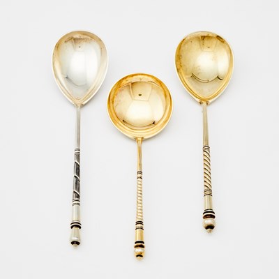 Lot 527 - Three Russian Parcel-Gilt Silver and Niello Spoons