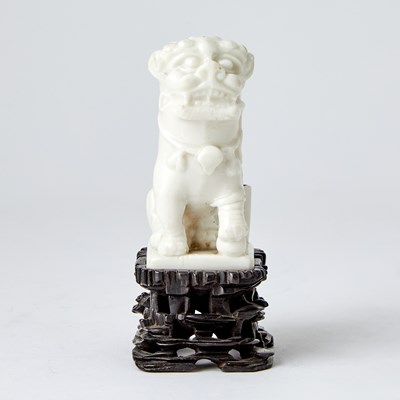 Lot 611 - A Small Chinese Dehua Porcelain Lion and Stand