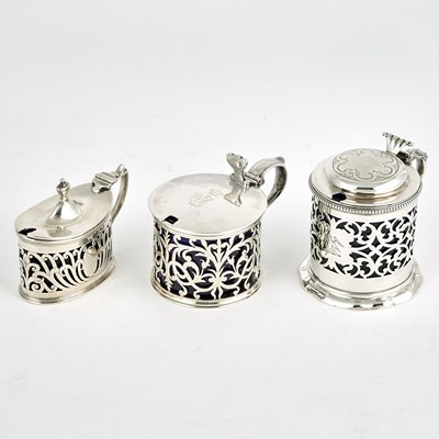 Lot 531 - Three English Sterling Silver and Blue Glass Mustard Pots