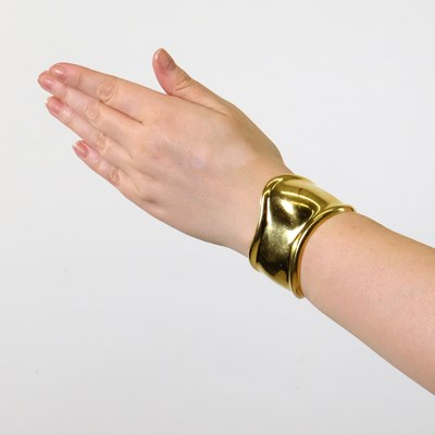 Lot 62 - Tiffany & Co., Elsa Peretti Gold 'Bone' Cuff Bangle Bracelet