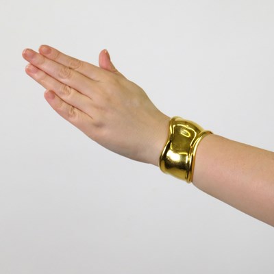 Lot 61 - Tiffany & Co., Elsa Peretti Gold 'Bone' Cuff Bangle Bracelet