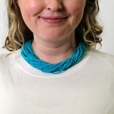 Lot 111 - Multistrand Turquoise Bead Torsade Necklace with Gold and Diamond Clasp