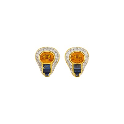 Lot 1144 - Pair of Two-Color Gold, Orange Sapphire, Sapphire and Diamond Earclips