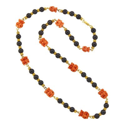 Lot 1008 - Long Gold, Carved Coral and Black Onyx Bead Necklace