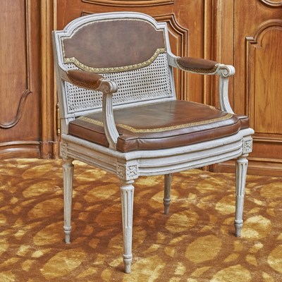 Lot 243 - Louis XVI Caned and Leather Upholstered Painted Wood Fauteuil