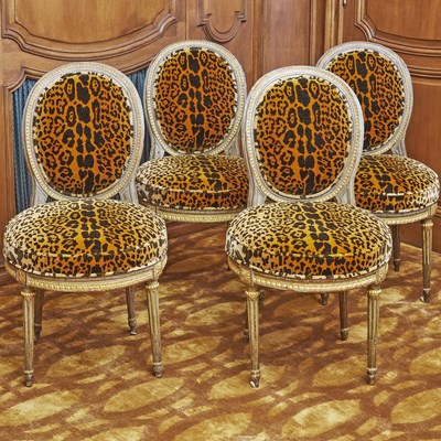 Lot 219 - Set of Four Louis XVI Upholstered Painted and Parcel Gilt Side Chairs