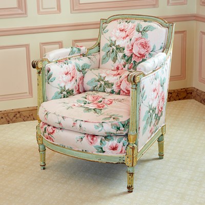 Lot 280 - Louis XVI Floral Chintz Upholstered Painted and Parcel Giltwood Bergere