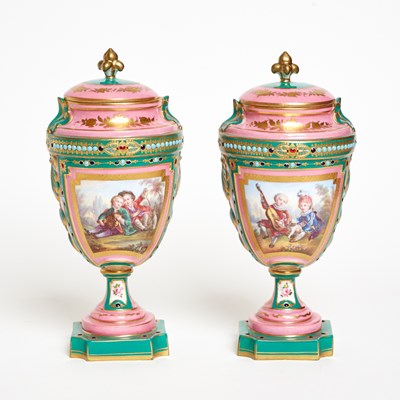 Lot 79 - Pair of Sevres Style Porcelain ‘Jeweled’ Pink and Green Ground Vases and Covers